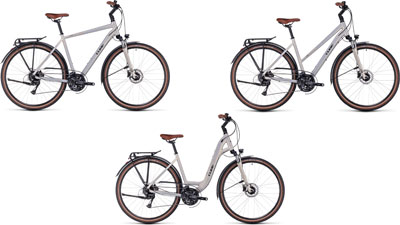 Drie Cube Touring Pro-fietsen naast elkaar: één met een diamant frame, één met een trapeziumvormig frame en één met een lage instap frame.